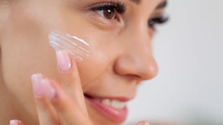 Skin care, woman use skin care products at home in light bathroom