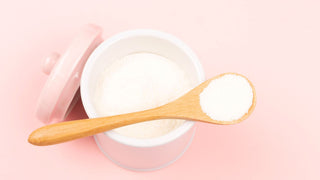 Collagen powder on pink background