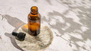 Dropper and bottle with essential oil, face serum or retinol or medicinal liquid