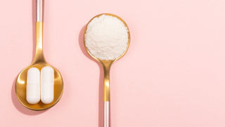 Hydrolyzed collagen supplement powder and capsule in gold spoon on pink background