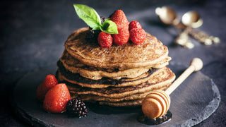 Pancakes with honey and berries