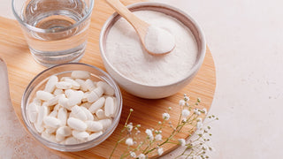 Plant based collagen booster supplements in bowls powder and pill with water
