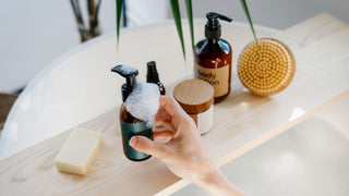 Skincare routine on wooden board in bathtub