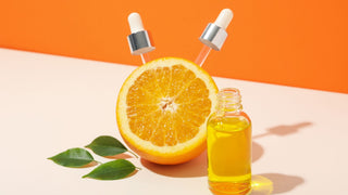 Vitamin C serum and orange fruit