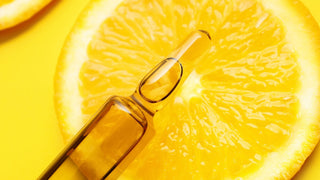 Vitamin C serum and orange slice