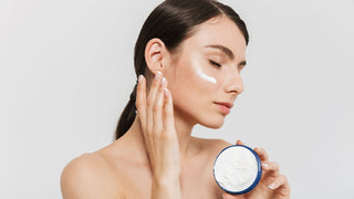 Woman Applying Skincare Cream