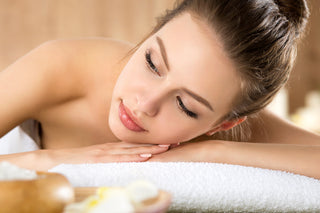 young woman lying down at spa salon